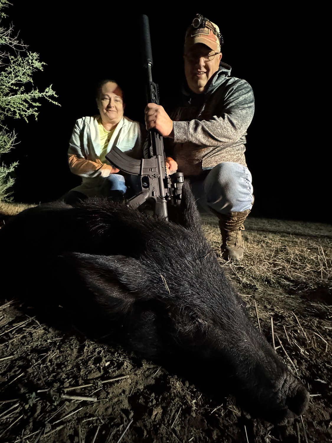 Mike and Angie celebrating a successful South Texas hog hunt and a hard-earned redemption.