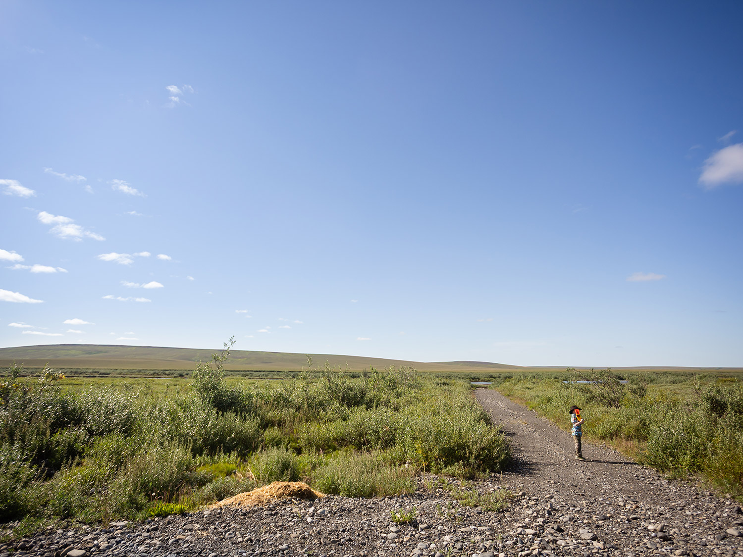 A lone trail stretches through the Arctic tundra near Kavik River Camp, where the scale of Alaska’s North Slope makes you feel both small and fully alive. Kavik River Camp Alaska Tundra Trail on the North Slope